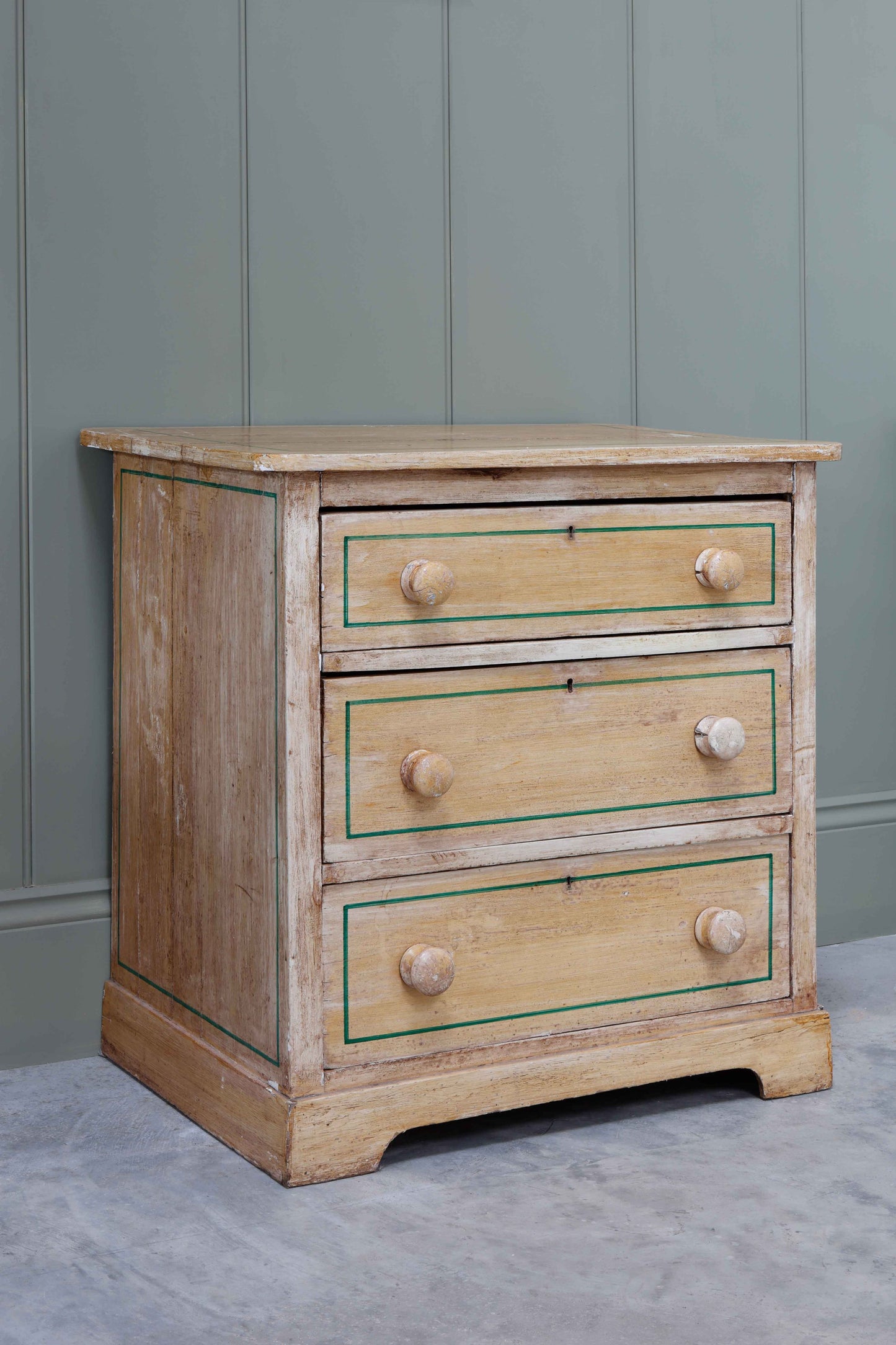 Pine Chest of Drawers with Green decoration.