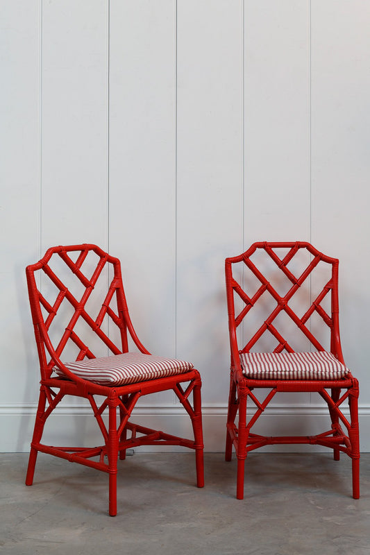 A Pair of Red Bamboo Chairs